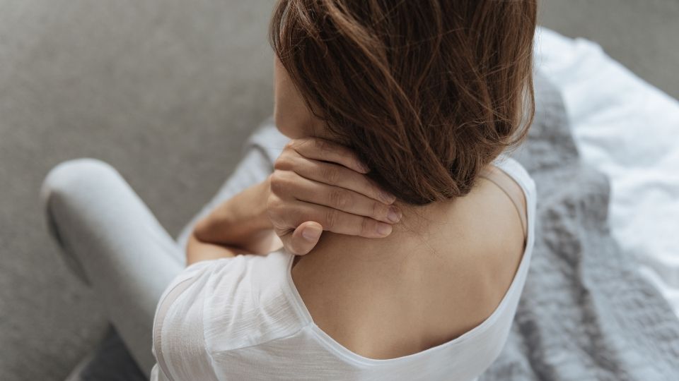 woman sleeping with neck pain