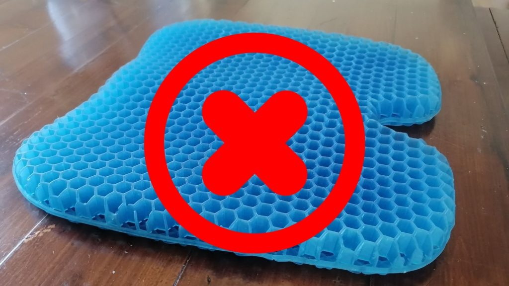 gel seat cushion with red cross on top of it