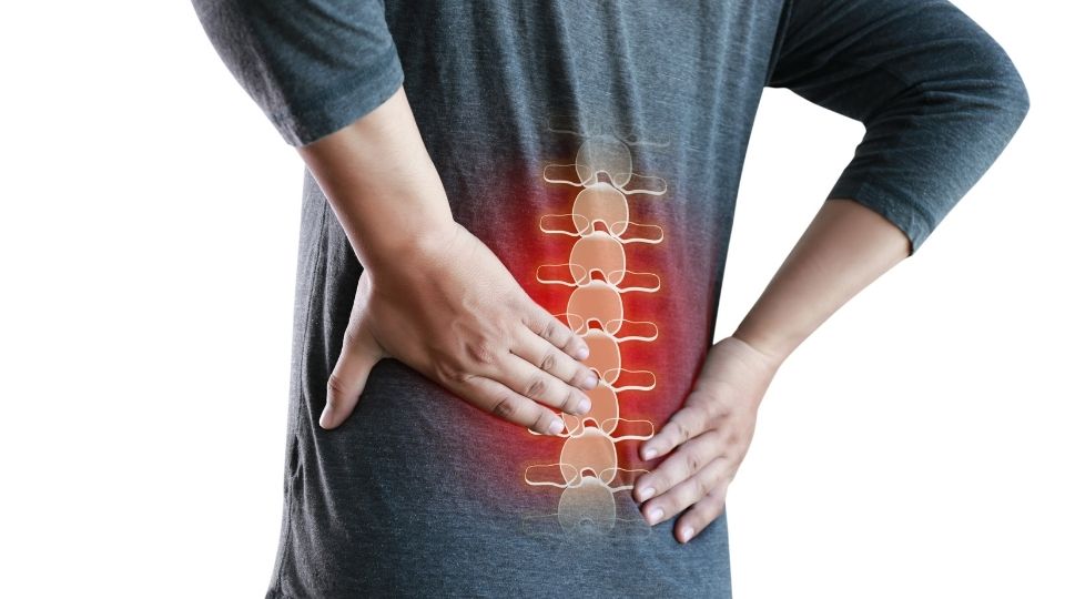man with lower lumbar pain with overlapping red pain and spine graphic 