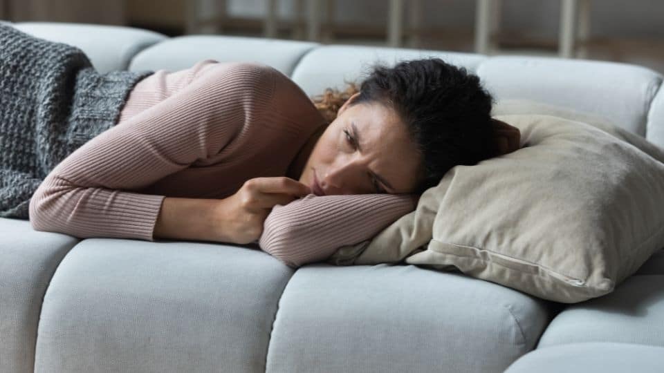 woman unable to sleep due to buttock pain