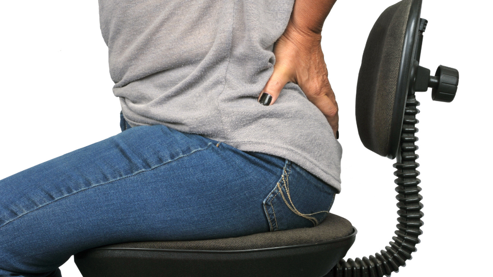 woman suffering with sciatica seated